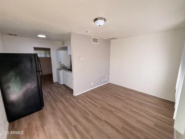 a view of a livingroom with wooden floor