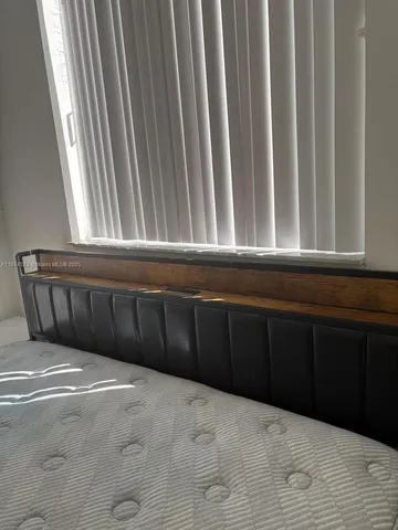 a bathroom with a shower and toilet