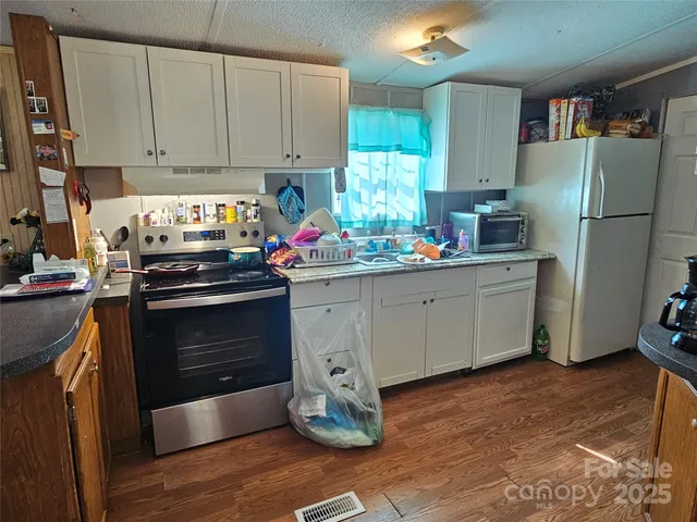a view of a dining room with many windows