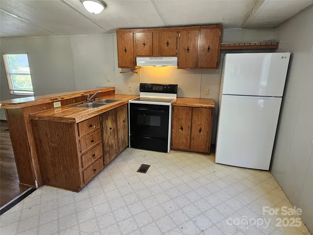 a kitchen with a stove and a refrigerator