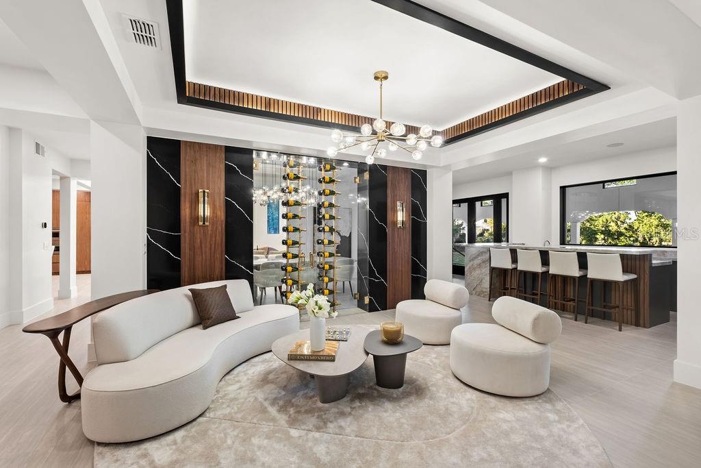9725 Chestnut Ridge Drive Windermere, FL 34786 - Photo 13 of 64 a living room with furniture and a chandelier