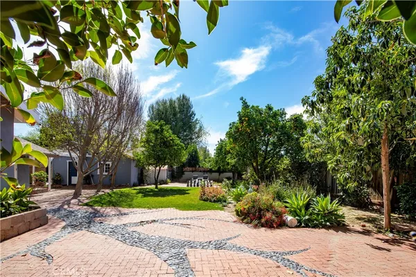 a view of a garden with a fountain