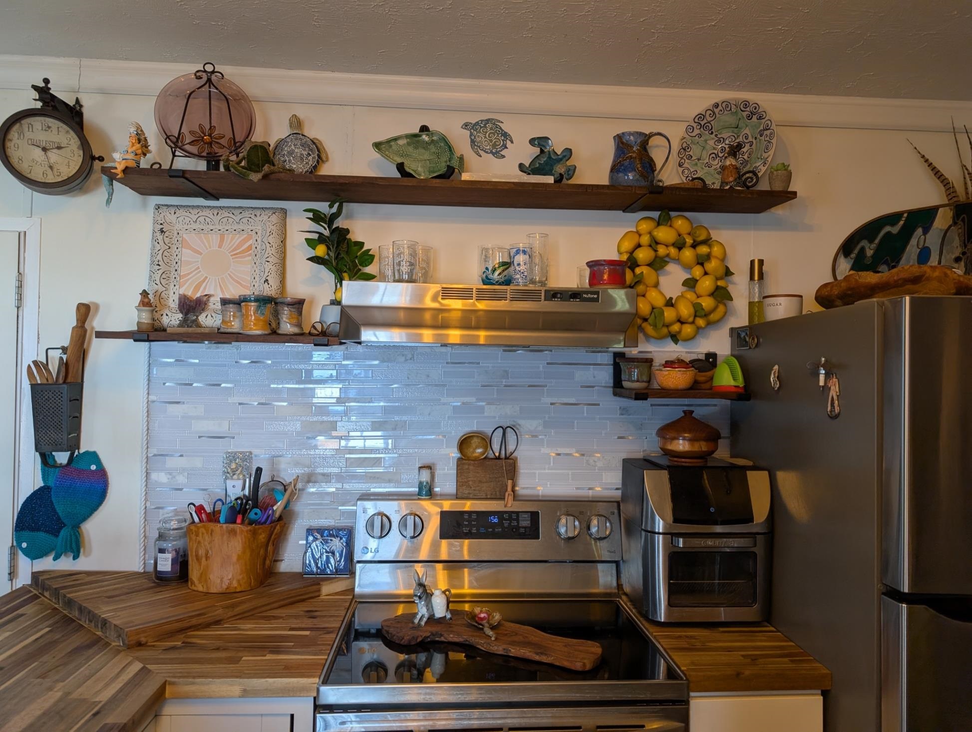 3 Poolside Drive Murrells Inlet, SC 29576 - Photo 12 of 40 Kitchen with butcher block counters, stainless steel appliances, and cool open shelves