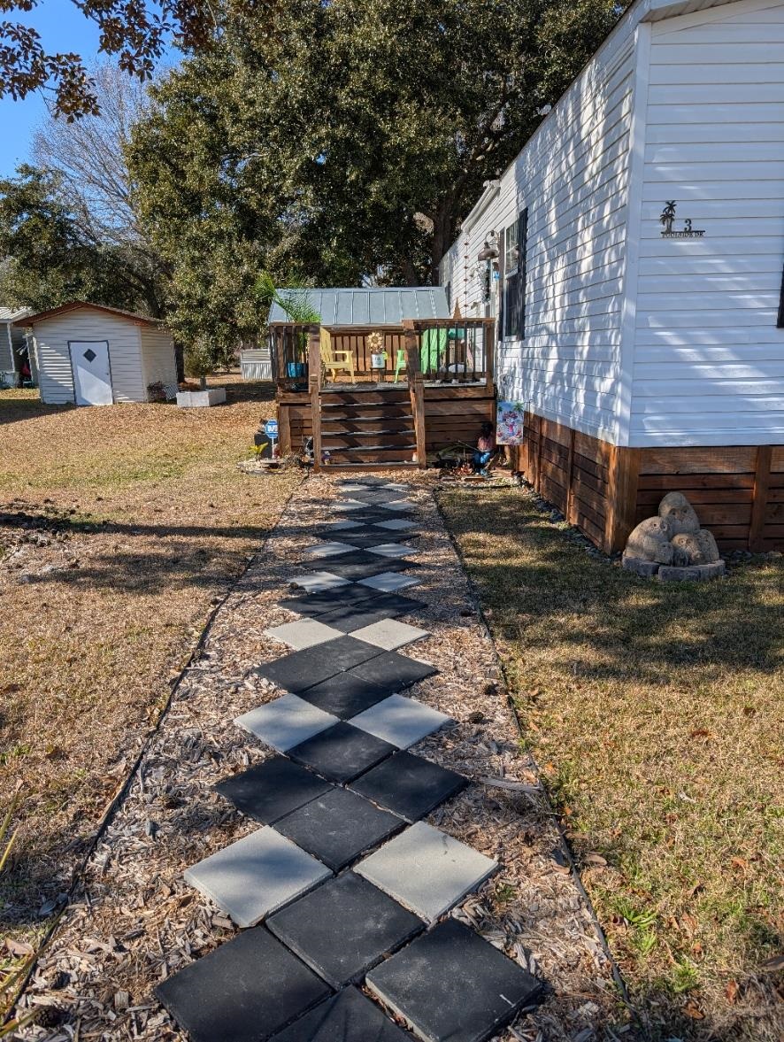 3 Poolside Drive Murrells Inlet, SC 29576 - Photo 2 of 40 Walk this path to the deck...then enter
