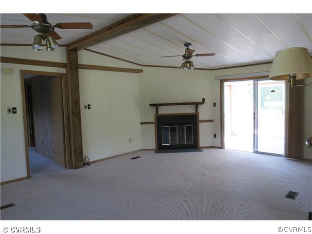 172 Callis Wharf Road Hudgins, VA 23076 - Photo 3 of 8 Living Room - Vaulted ceiling, fireplace, kitchen