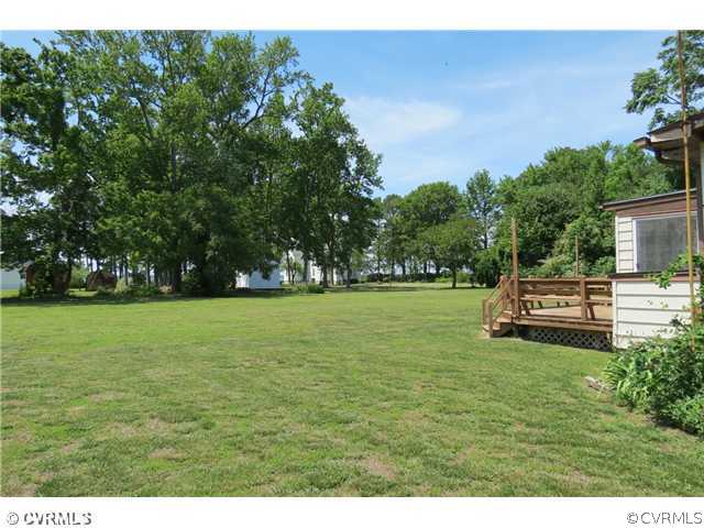 172 Callis Wharf Road Hudgins, VA 23076 - Photo 8 of 8 Yard/Garden - Views of the spacious yard. One side