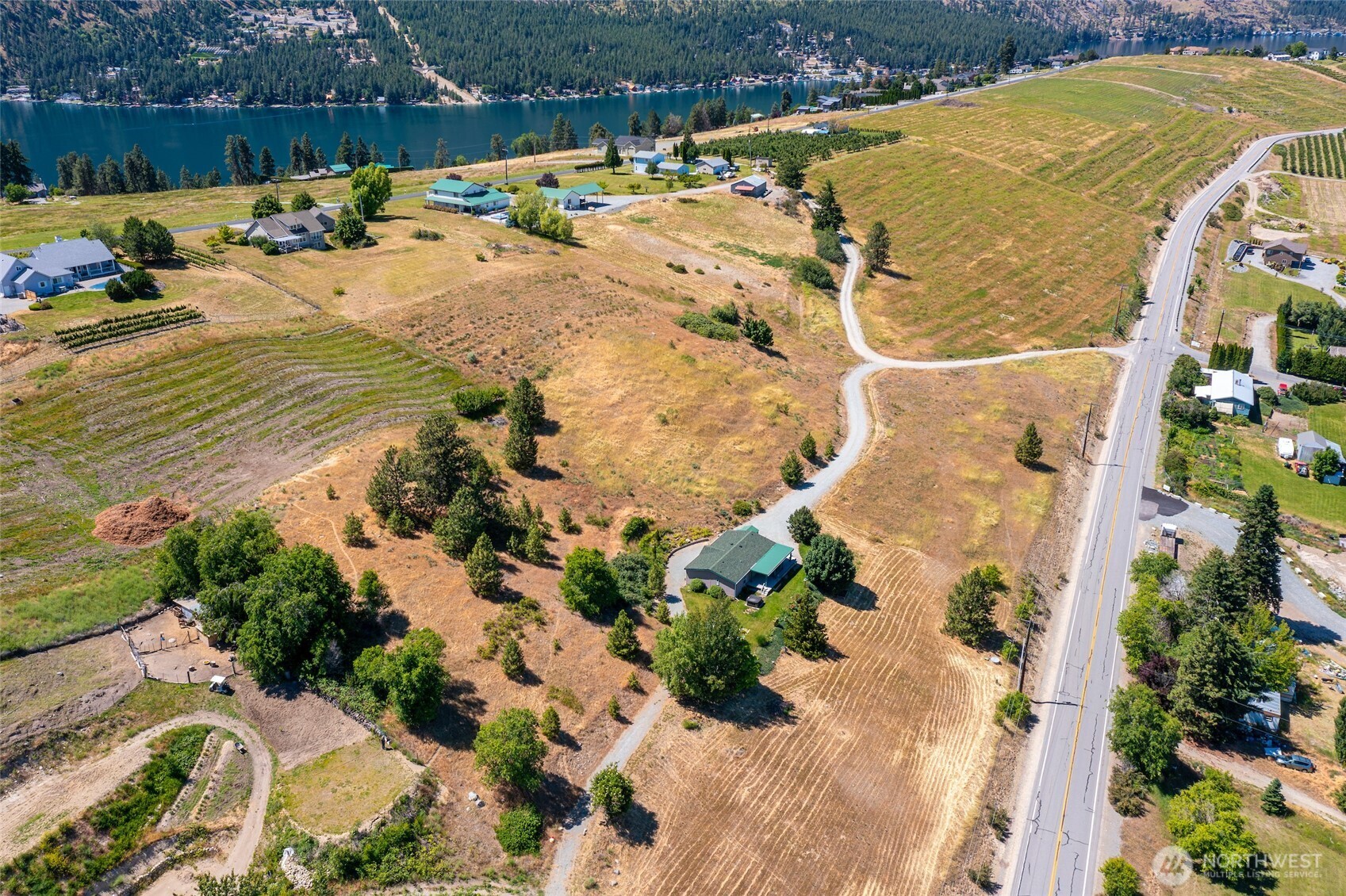 32 Barkley Road Manson, WA 98831 - Photo 3 of 17 a view of a swimming pool with a yard