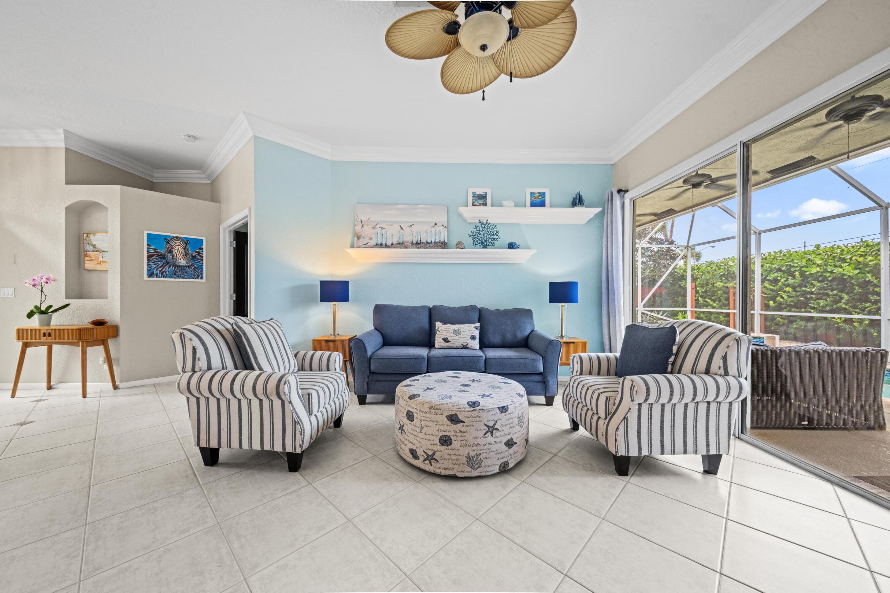 1365 East Barwick Ranch Circle Delray Beach, FL 33445 - Photo 11 of 77 a bedroom with a bed and a chandelier