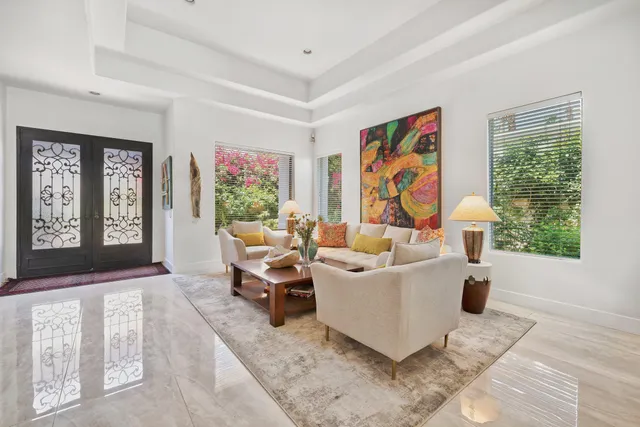 a living room with furniture and windows