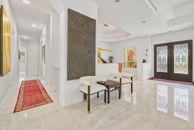 a living room with furniture and a rug