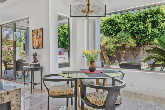 a dining room with furniture and window