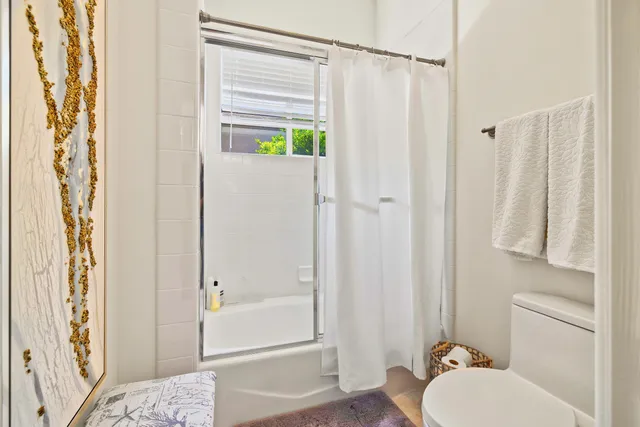 a bathroom with a shower curtain