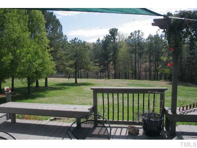 801 Brookfield Road Raleigh, NC 27615 - Photo 16 of 17 a view of a wooden deck and a yard
