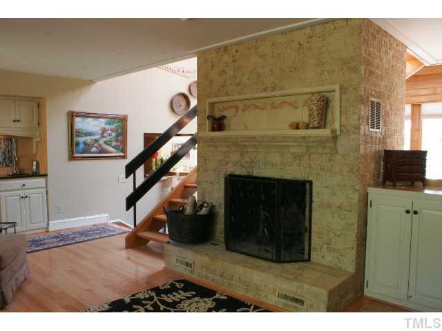 801 Brookfield Road Raleigh, NC 27615 - Photo 5 of 17 a living room with furniture and a fireplace