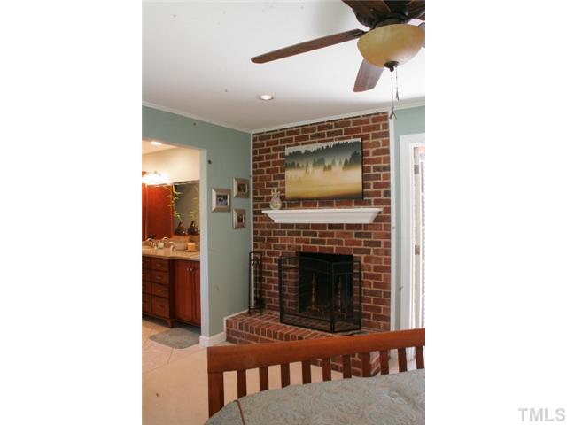 801 Brookfield Road Raleigh, NC 27615 - Photo 10 of 17 a living room with furniture and a fireplace