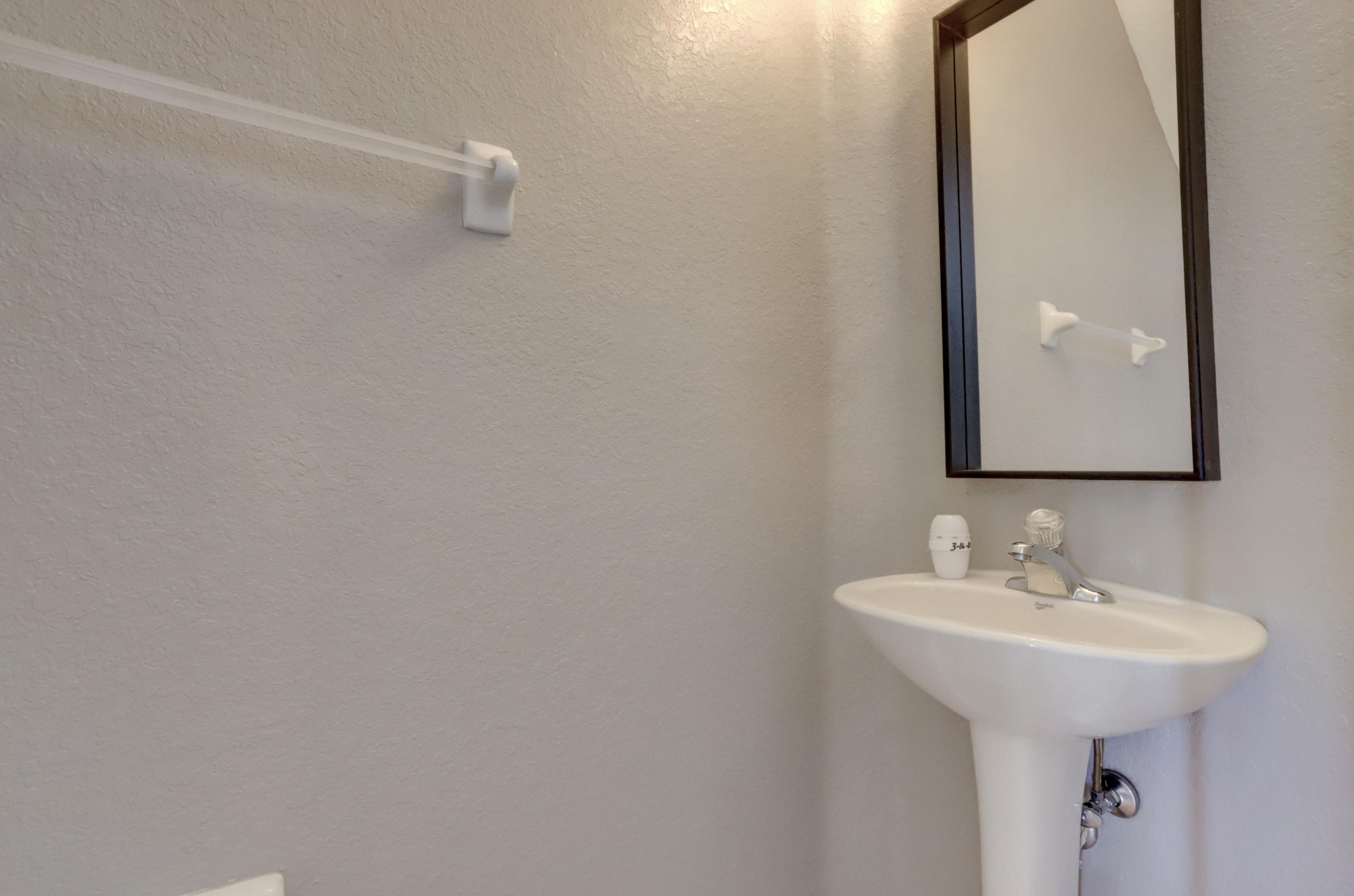 5909 Riverside Avenue Tamarac, FL 33321 - Photo 16 of 32 a bathroom with a sink and mirror