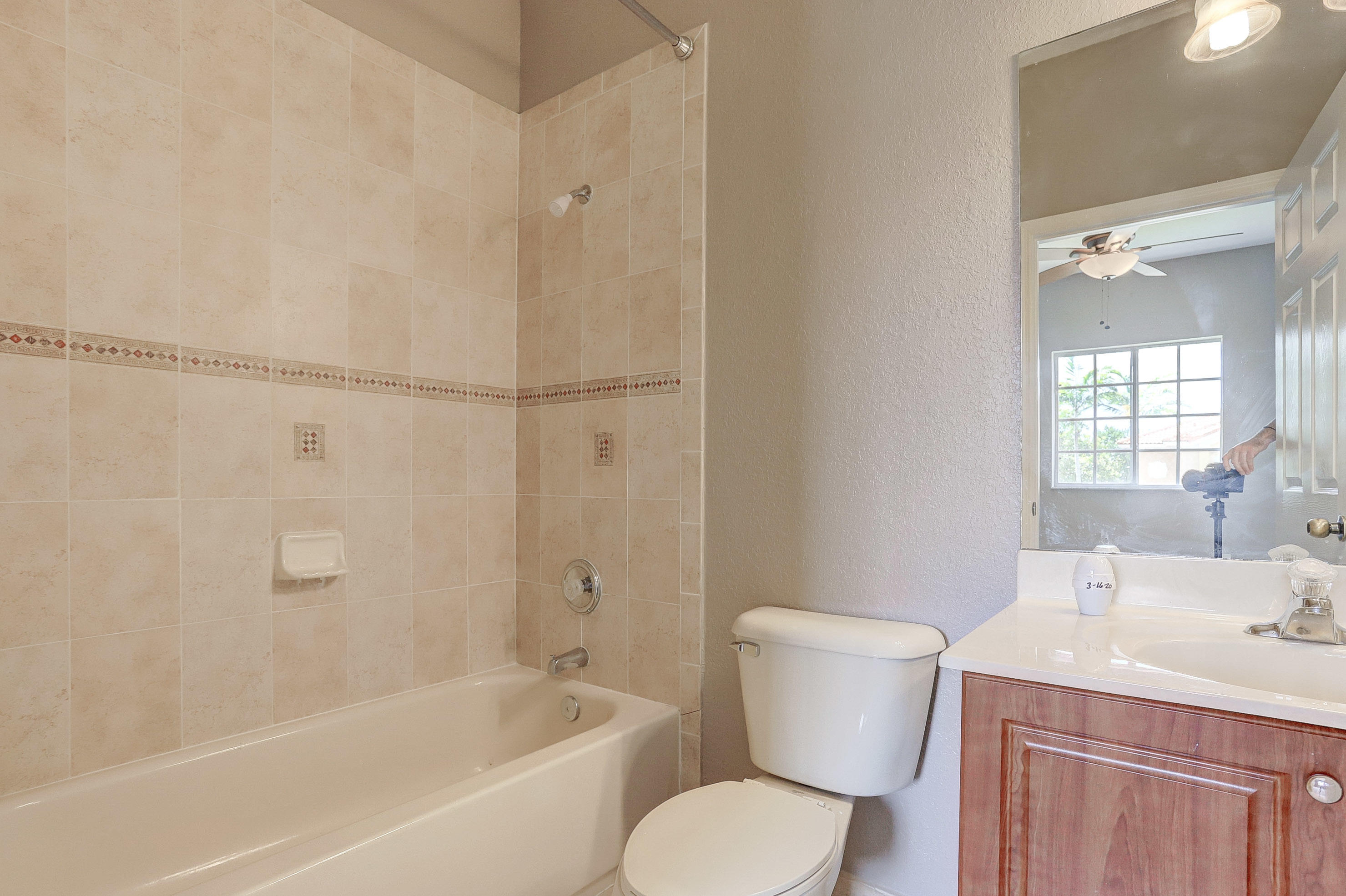5909 Riverside Avenue Tamarac, FL 33321 - Photo 23 of 32 a bathroom with a sink toilet and shower