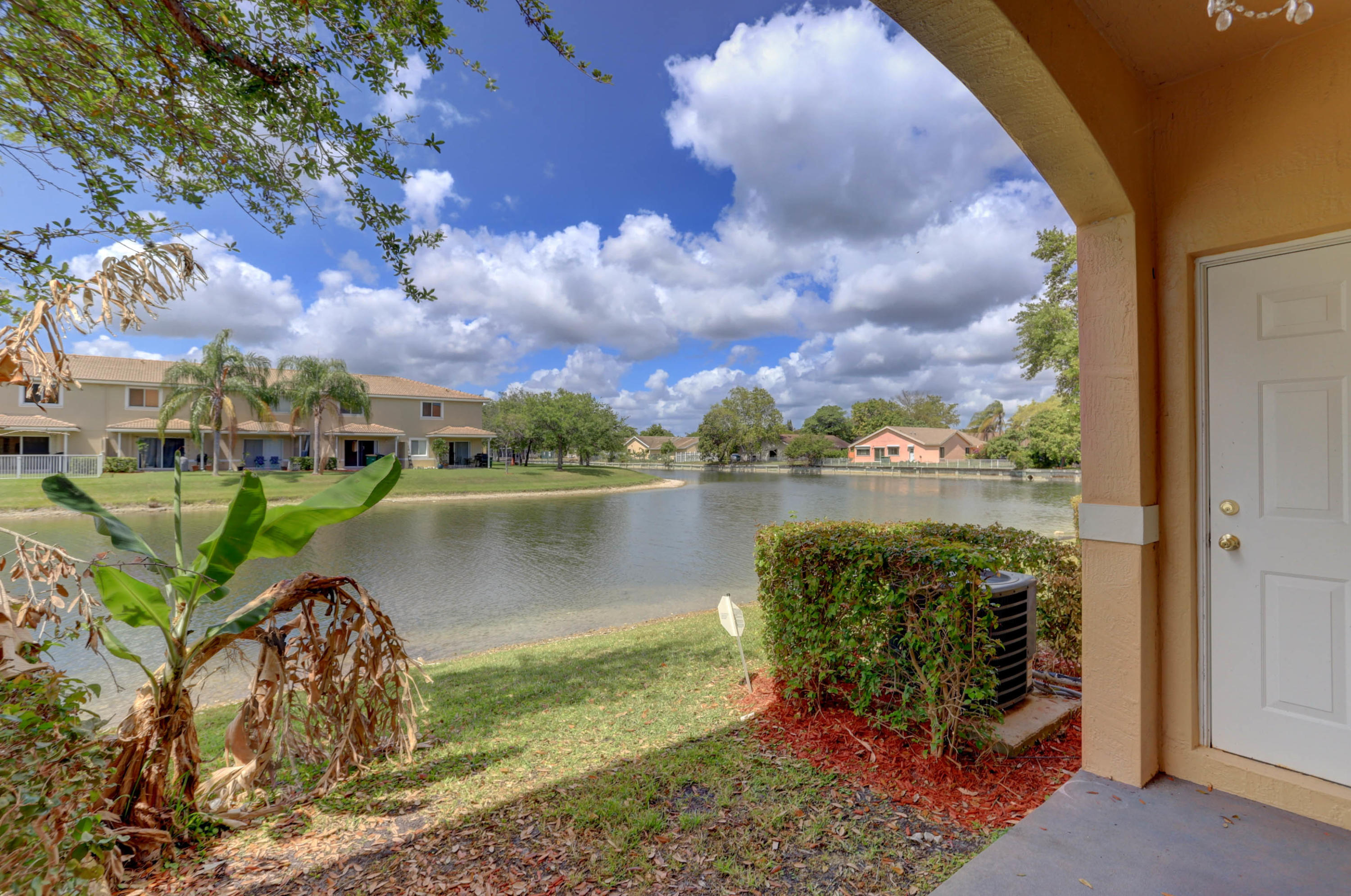 5909 Riverside Avenue Tamarac, FL 33321 - Photo 25 of 32 an aerial view of a house with a lake view