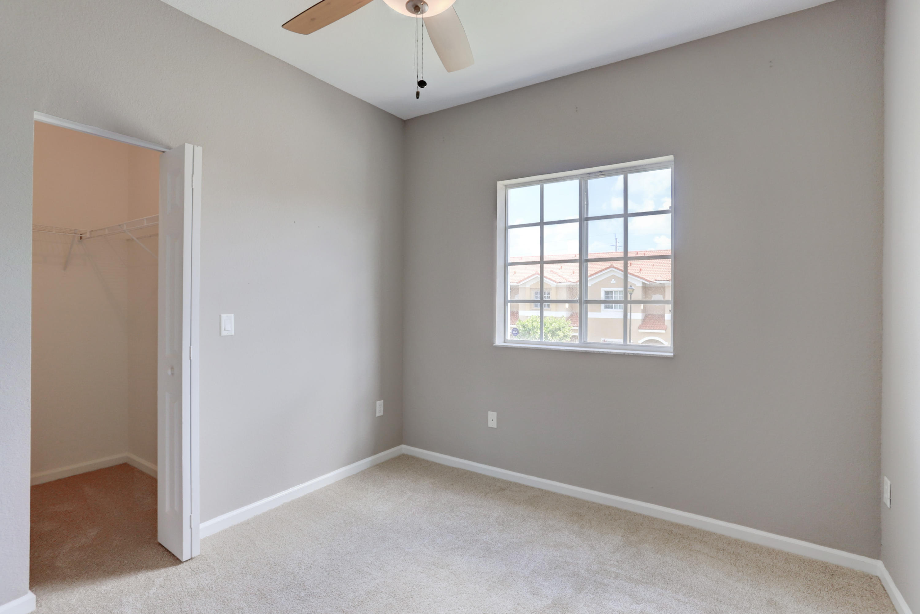 5909 Riverside Avenue Tamarac, FL 33321 - Photo 8 of 32 an empty room with a window