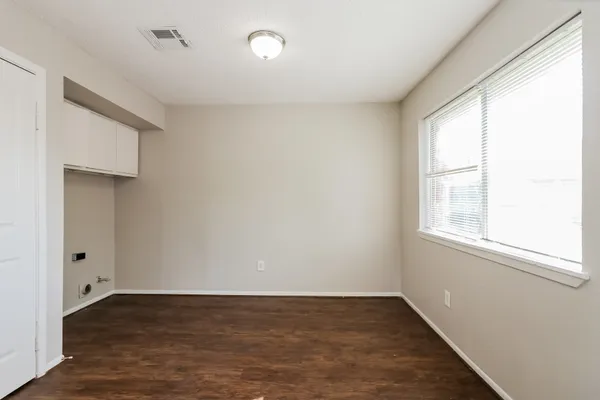 a kitchen with stainless steel appliances white cabinets and a stove