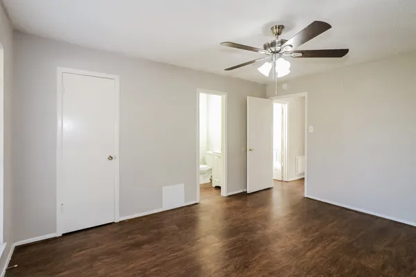 a bathroom with a sink mirror vanity and toilet