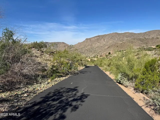 a view of a road with an ocean view