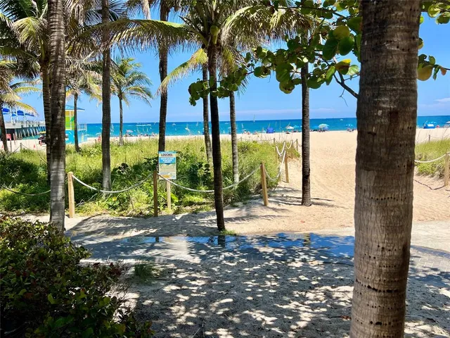a view of a swimming pool with sitting area