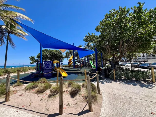 a view of outdoor space with seating area and car parked