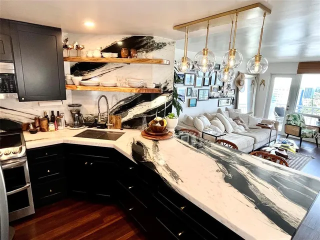 a kitchen with a sink and cabinets