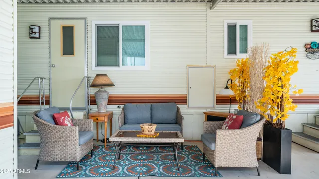 a outdoor living space with furniture and a potted plant