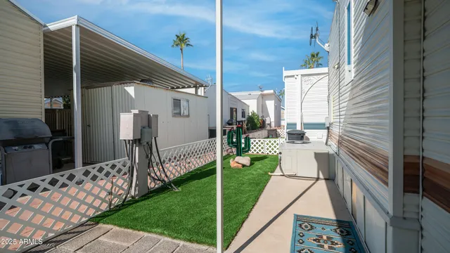 a view of a house with a yard table and chairs