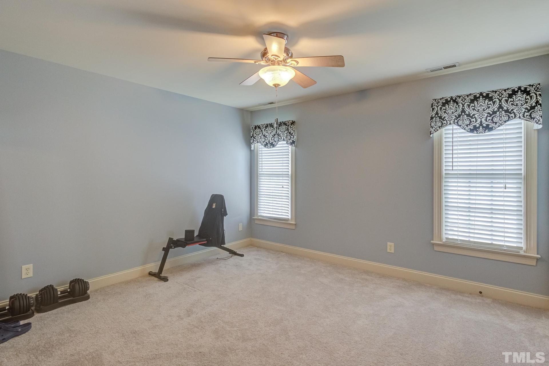 108 Challenge Road Raleigh, NC 27603 - Photo 36 of 60 a view of a workspace with furniture and a window