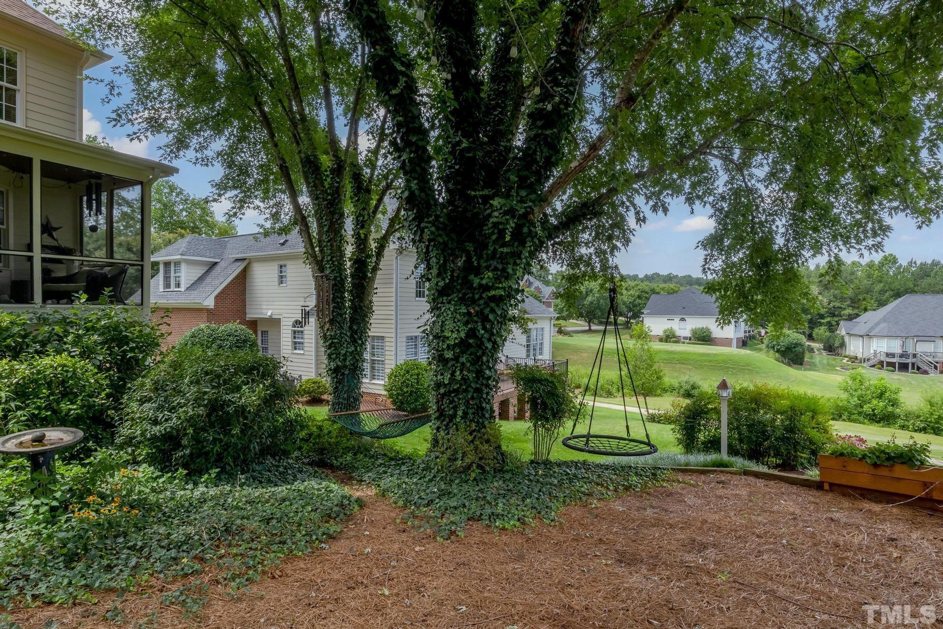108 Challenge Road Raleigh, NC 27603 - Photo 59 of 60 a view of a park with plants and large trees