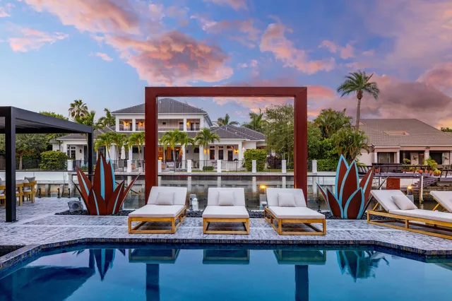 a view of swimming pool with outdoor seating