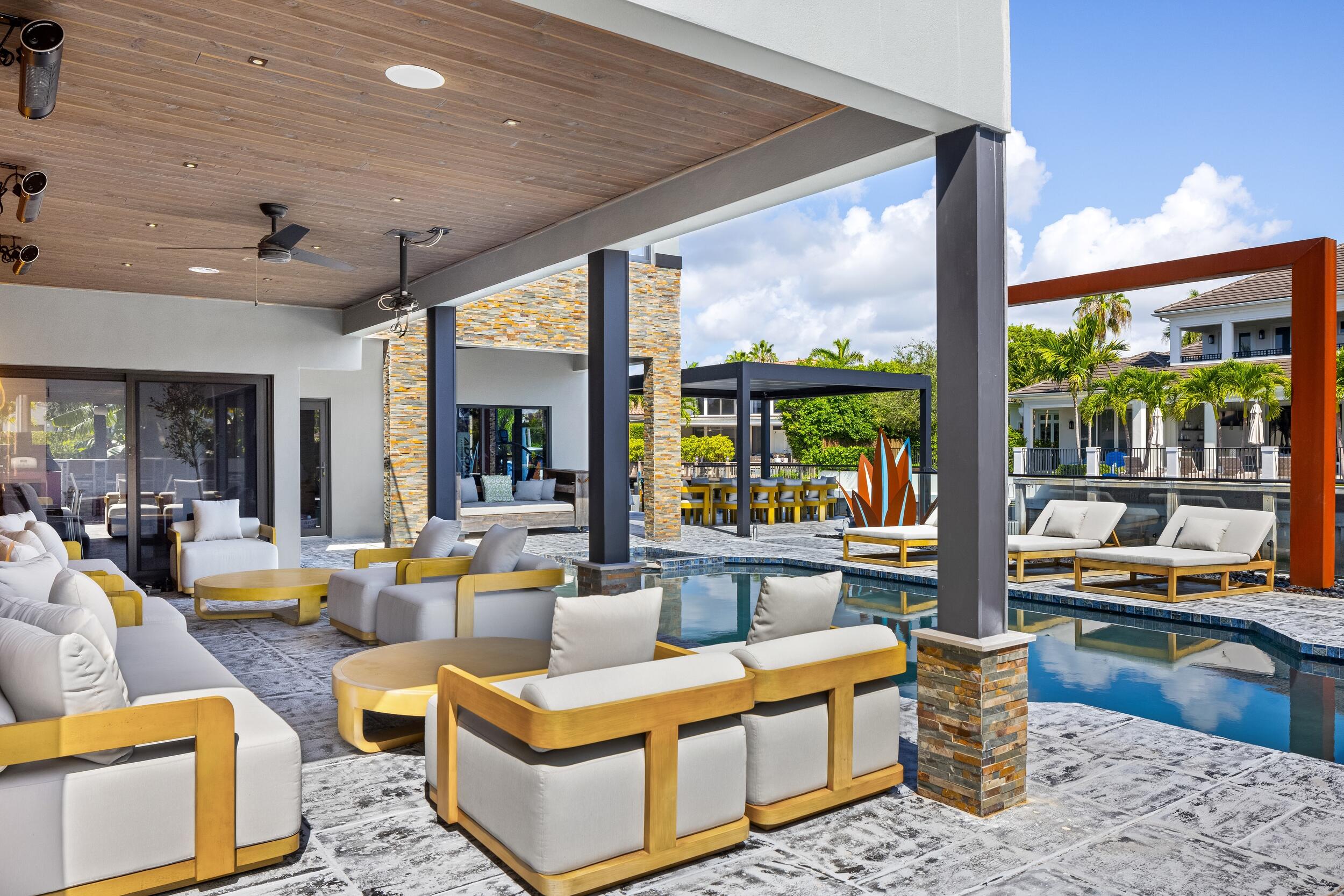 839 Northeast Bay Isle Drive Boca Raton, FL 33487 - Photo 15 of 103 a living room with furniture and a large window