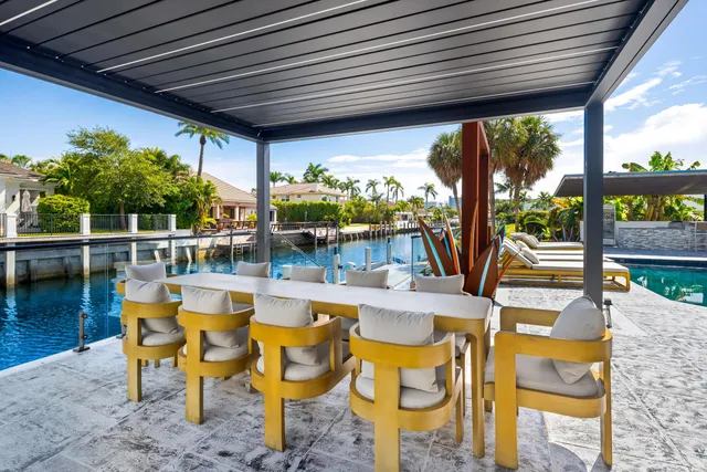 a kitchen with stainless steel appliances kitchen island granite countertop a stove a sink and a microwave