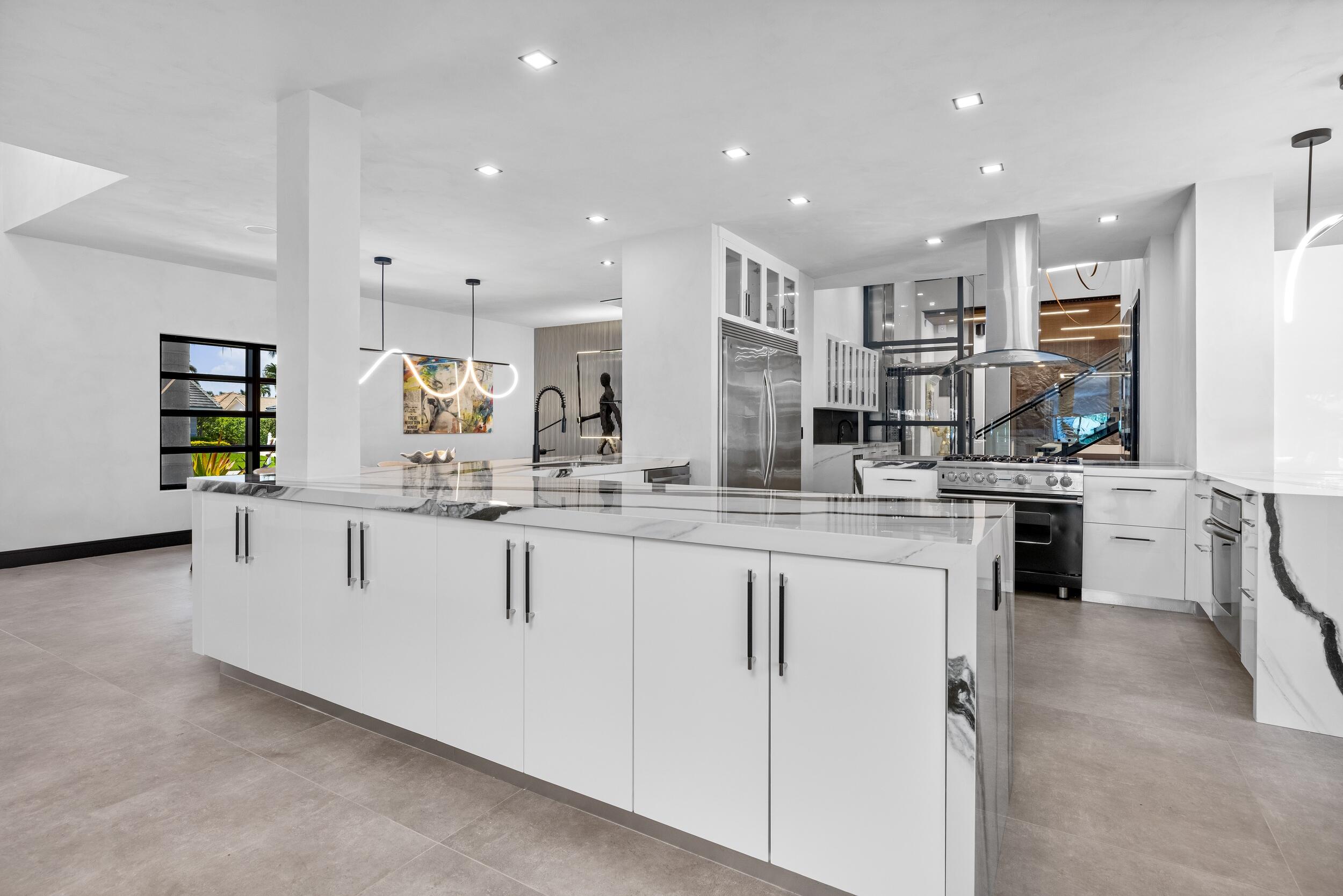 839 Northeast Bay Isle Drive Boca Raton, FL 33487 - Photo 23 of 103 a kitchen with counter top space and appliances