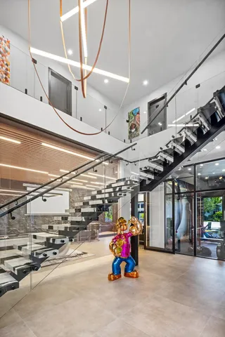 a bathroom with double vanity sinks and a mirror