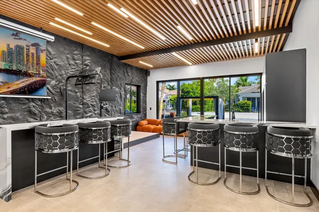a bathroom with a glass shower door and a window