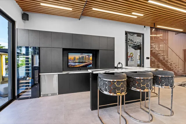 a view of storage and utility room with wooden floor and cabinets
