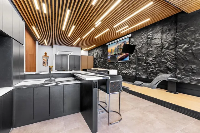 a bedroom with two beds and painted walls