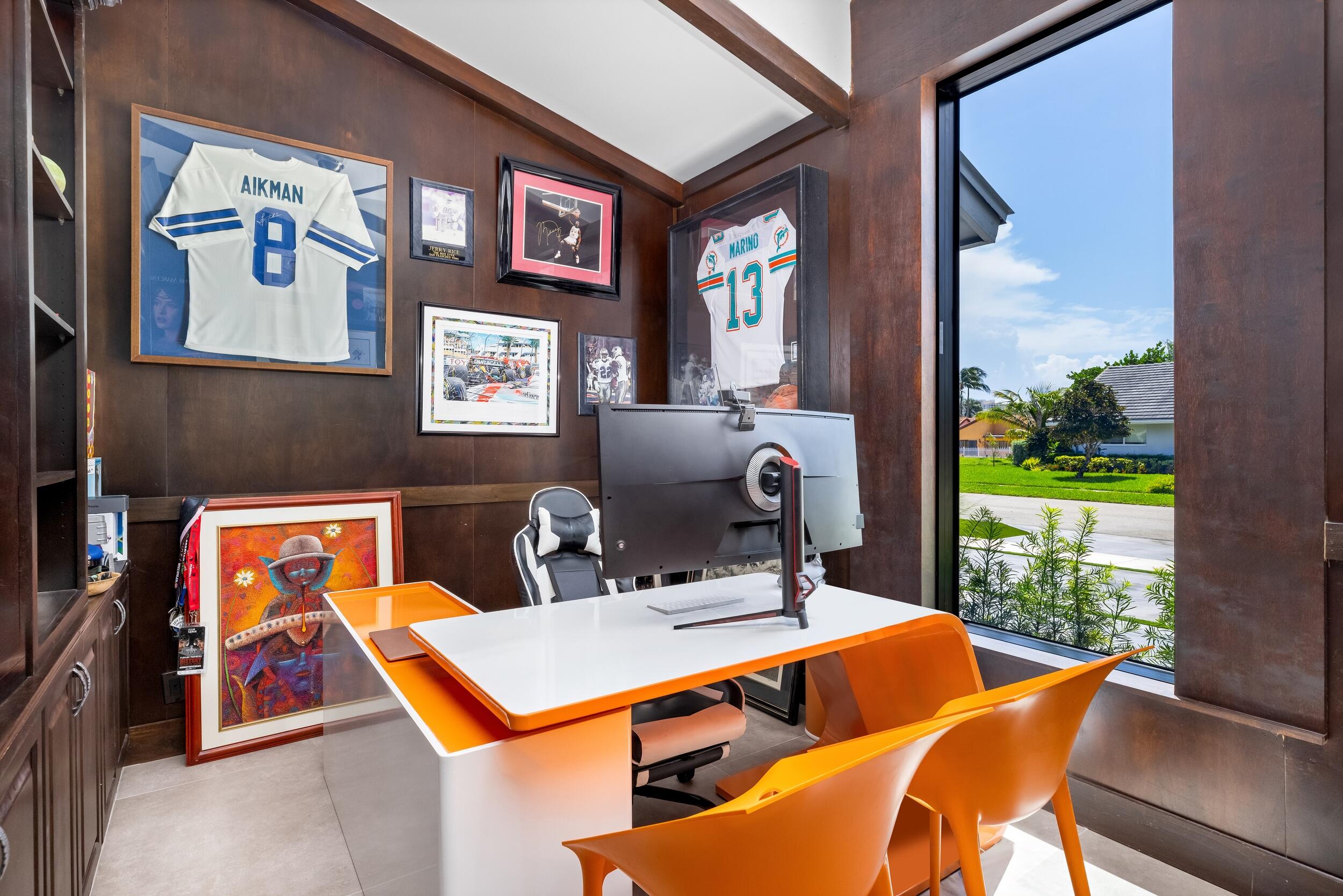 839 Northeast Bay Isle Drive Boca Raton, FL 33487 - Photo 47 of 103 a blue kitchen with a table and chairs in it