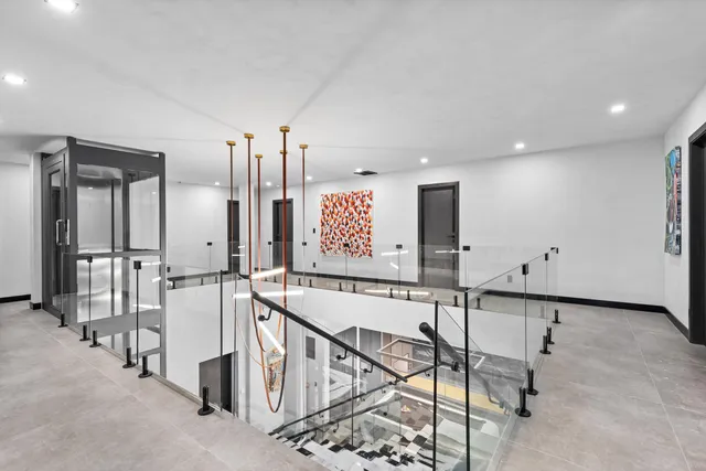 a view of a house with a swimming pool and a yard