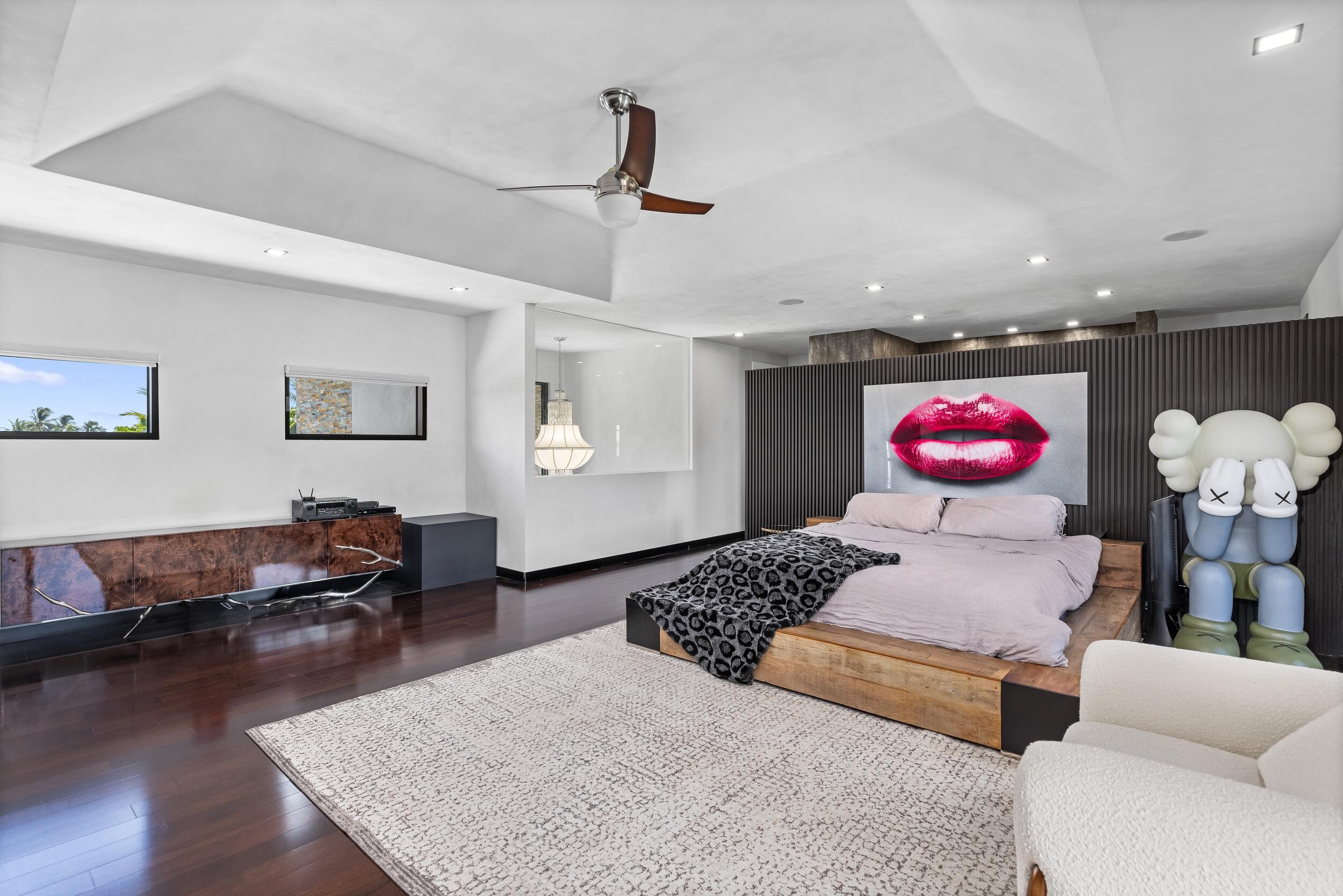 839 Northeast Bay Isle Drive Boca Raton, FL 33487 - Photo 53 of 103 a bedroom with furniture and a bed