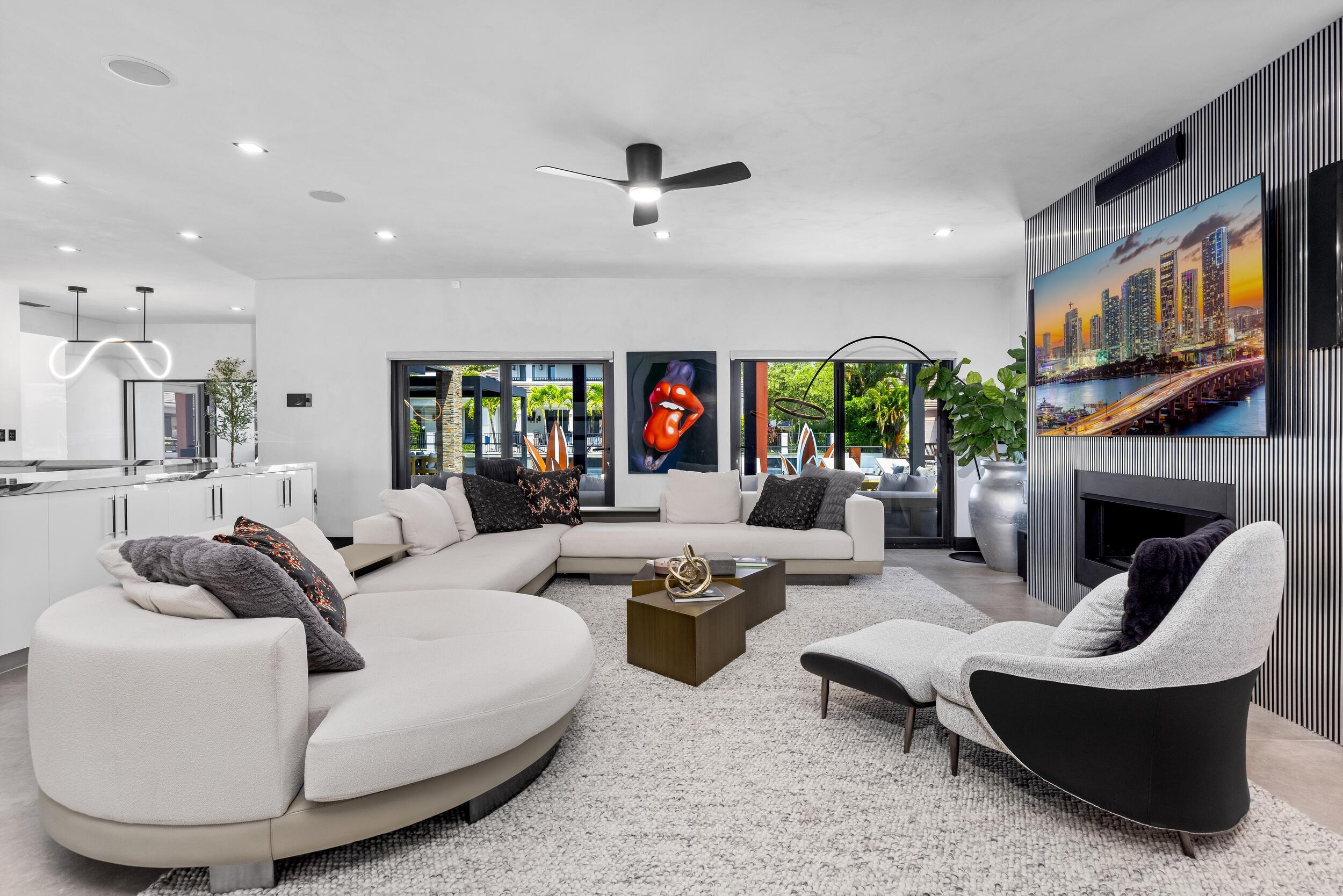 839 Northeast Bay Isle Drive Boca Raton, FL 33487 - Photo 6 of 103 a living room with fireplace furniture and a large window