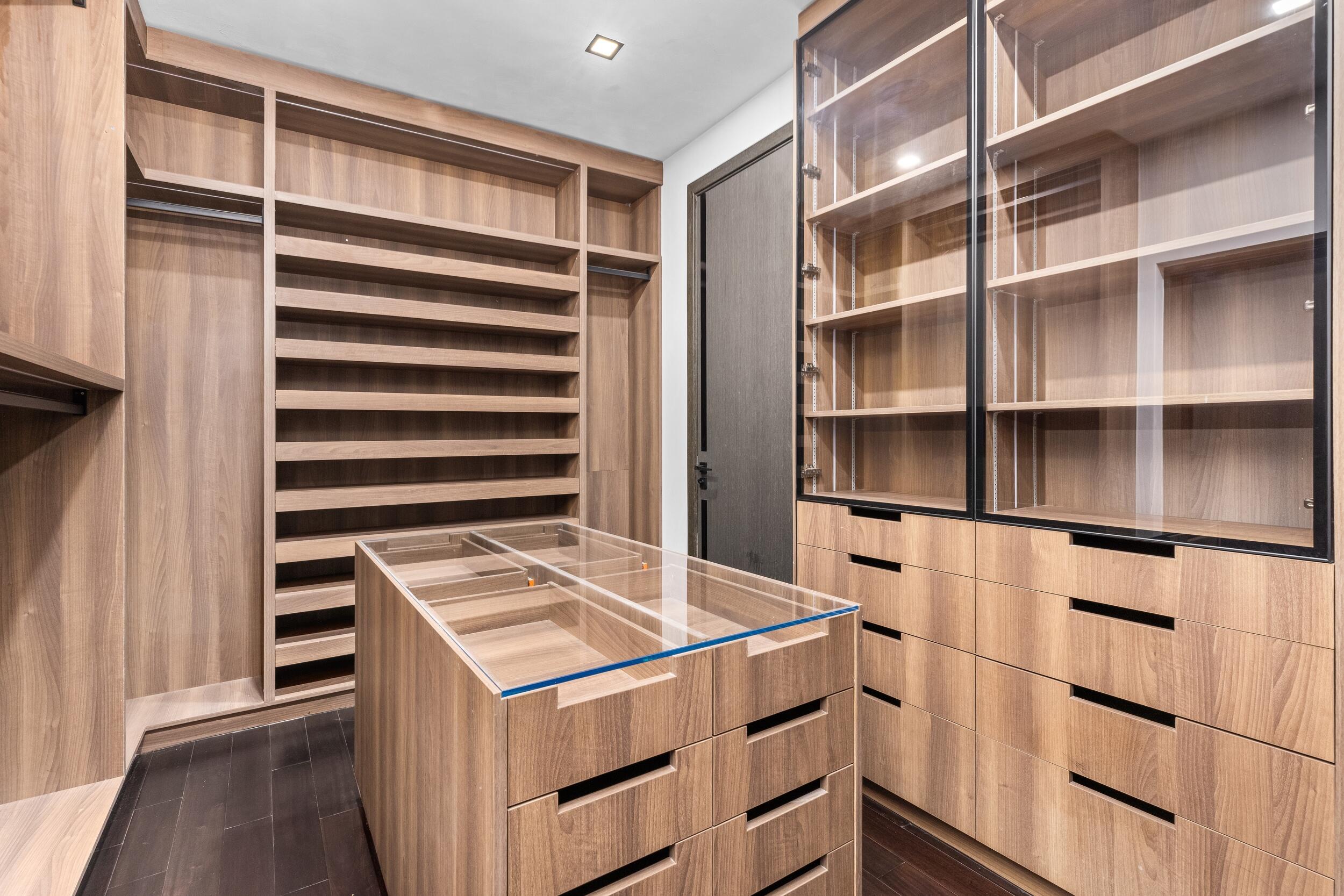 839 Northeast Bay Isle Drive Boca Raton, FL 33487 - Photo 65 of 103 a view of storage and utility room with wooden floor and cabinets