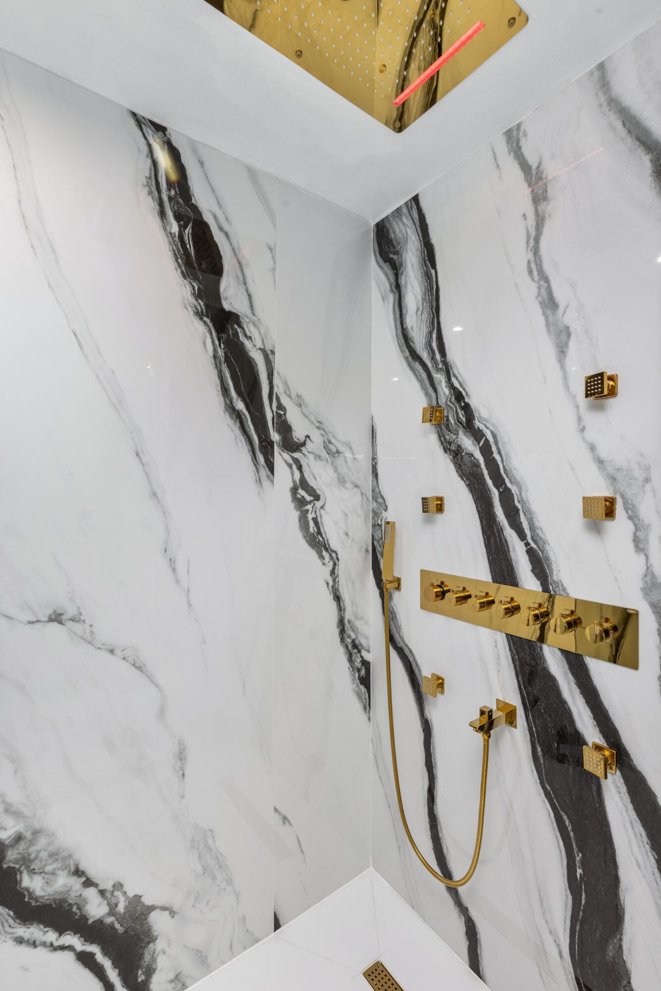 839 Northeast Bay Isle Drive Boca Raton, FL 33487 - Photo 70 of 103 a view of walk in closet with clothes and shoes