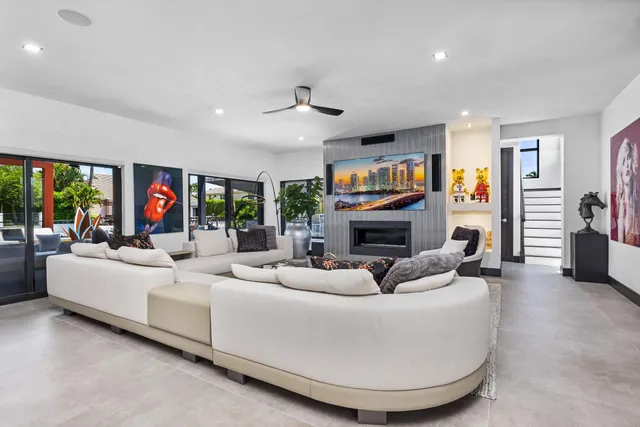 a view of a dinning room with furniture and floor to ceiling window