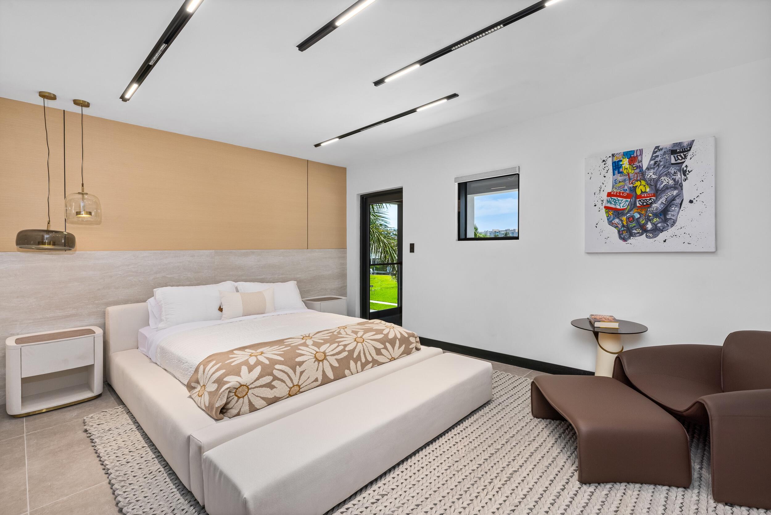 839 Northeast Bay Isle Drive Boca Raton, FL 33487 - Photo 79 of 103 a bedroom with a bed couch and painting on the wall