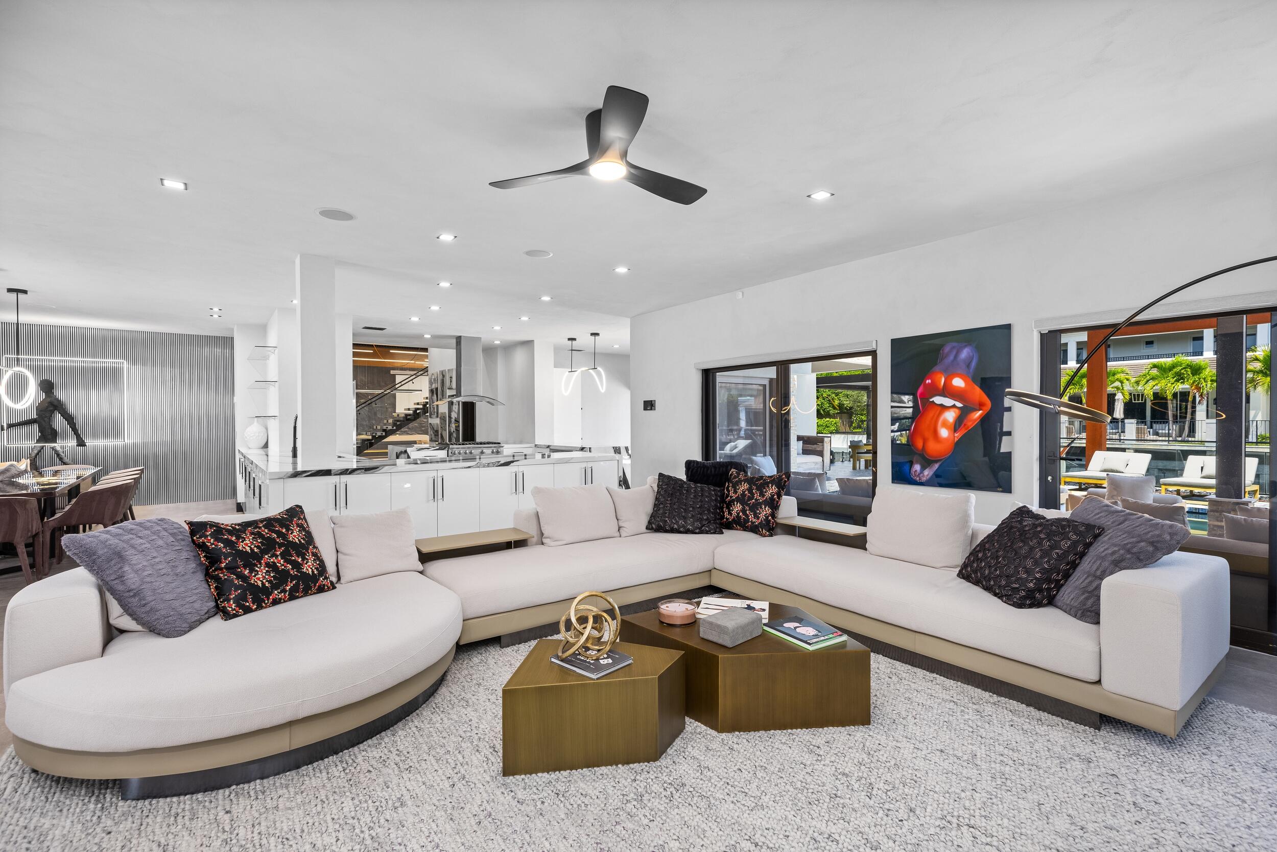 839 Northeast Bay Isle Drive Boca Raton, FL 33487 - Photo 8 of 103 a living room with furniture and a ceiling fan
